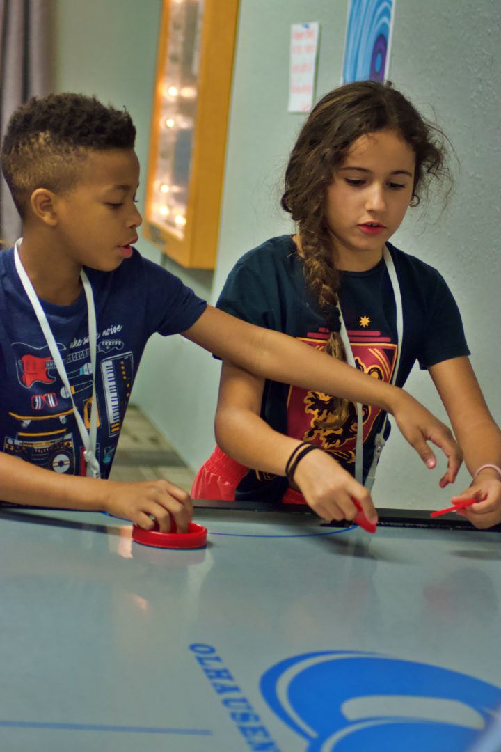 Children play air hockey at The Harbor Church in Odessa, FL